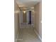 Hallway featuring tile flooring and modern lighting fixtures at 4132 E Sweetwater Ave, Phoenix, AZ 85032