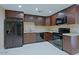 Updated kitchen featuring granite countertops and modern appliances at 4132 E Sweetwater Ave, Phoenix, AZ 85032