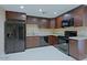 Well-equipped kitchen with stainless steel appliances, granite countertops, and stylish cabinetry at 4132 E Sweetwater Ave, Phoenix, AZ 85032