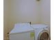 This laundry room has a white top loading washer and white front loading dryer at 4132 E Sweetwater Ave, Phoenix, AZ 85032