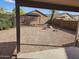 Large backyard featuring gravel, raised block planter, and block wall at 4613 W Fawn Dr, Laveen, AZ 85339