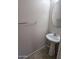 Small half-bathroom featuring pedestal sink, round mirror, and tiled floor at 4613 W Fawn Dr, Laveen, AZ 85339