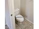 Cozy half-bathroom with new toilet featuring blue tape, and tiled floor at 4613 W Fawn Dr, Laveen, AZ 85339