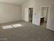 Spacious main bedroom with modern carpeting, neutral walls, and two entry doors at 4613 W Fawn Dr, Laveen, AZ 85339