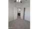 Bedroom with plush carpeting, a closet and view to an ensuite bathroom at 4613 W Fawn Dr, Laveen, AZ 85339