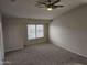 Bedroom featuring plush carpeting, a ceiling fan, and a window providing natural light at 4613 W Fawn Dr, Laveen, AZ 85339