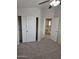 Bedroom with plush carpeting, a closet and views of the hallway at 4613 W Fawn Dr, Laveen, AZ 85339