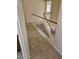 Second-story hallway featuring tiled floor with white banisters overlooking staircase at 4613 W Fawn Dr, Laveen, AZ 85339
