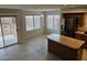 Bright kitchen with a center island, tile floors, stainless steel appliances, and breakfast nook with backyard access at 4613 W Fawn Dr, Laveen, AZ 85339