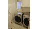 Laundry area featuring modern front-loading washer and dryer with window for light at 4613 W Fawn Dr, Laveen, AZ 85339