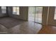 Open concept floorplan featuring tile and carpeted flooring, large windows, and sliding patio door at 4613 W Fawn Dr, Laveen, AZ 85339