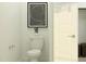 Chic half bathroom featuring a modern toilet, stylish art, and a clean aesthetic at 4752 E Topaz Dr, San Tan Valley, AZ 85140