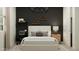 Modern bedroom featuring a bed with a unique headboard, a sleek desk, and geometric decorations at 4752 E Topaz Dr, San Tan Valley, AZ 85140