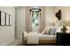 Cozy bedroom with a bed, a rustic light fixture, and a horse-themed decor at 4752 E Topaz Dr, San Tan Valley, AZ 85140