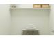 Well-organized closet space featuring shelving and a bench with neatly stacked towels at 4752 E Topaz Dr, San Tan Valley, AZ 85140