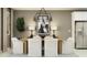 Dining room with a wooden table, white chairs, chandelier, and stainless refrigerator at 4752 E Topaz Dr, San Tan Valley, AZ 85140