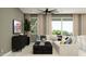 Bright living room featuring a cozy sectional, modern furniture, and sliding glass doors to the backyard at 4752 E Topaz Dr, San Tan Valley, AZ 85140