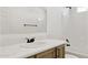 Bathroom vanity with a marble countertop, modern faucet, and bathtub shower at 51210 W Bluejay St, Maricopa, AZ 85139