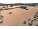 Aerial view of a desert home on a large lot with natural landscaping and privacy at 51288 W Bluejay St, Maricopa, AZ 85139