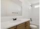 Bathroom featuring modern hardware, a tub/shower and vanity with stone countertops at 51288 W Bluejay St, Maricopa, AZ 85139
