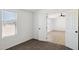 Bedroom featuring a window with blinds and doorway leading to another room at 51288 W Bluejay St, Maricopa, AZ 85139