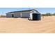 Home exterior features a well system and spacious, natural surroundings at 51288 W Bluejay St, Maricopa, AZ 85139