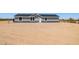 Charming single-story home with gray siding and a well-maintained, xeriscaped front yard at 51288 W Bluejay St, Maricopa, AZ 85139