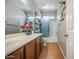 Bright bathroom with a sink and a decorative shelf that provides extra storage at 5342 W Maldonado Rd, Laveen, AZ 85339