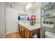 Bright bathroom with a sink and a decorative shelf that provides extra storage at 5342 W Maldonado Rd, Laveen, AZ 85339