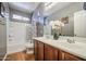 Bathroom featuring a shower-tub combo, double sinks, with gray walls at 5342 W Maldonado Rd, Laveen, AZ 85339