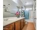 Bright bathroom with a sink and a decorative shelf that provides extra storage at 5342 W Maldonado Rd, Laveen, AZ 85339