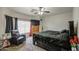 Bedroom featuring neutral carpet, dark furniture, and a window view at 5342 W Maldonado Rd, Laveen, AZ 85339