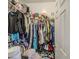 A walk-in closet packed with clothes on a wire rack and shoes at 5342 W Maldonado Rd, Laveen, AZ 85339