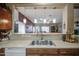 Galley style kitchen featuring stainless steel sink and a pass-through design at 5342 W Maldonado Rd, Laveen, AZ 85339