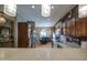 Open-concept kitchen with view into dining area, stainless steel appliances, and updated cabinetry at 5342 W Maldonado Rd, Laveen, AZ 85339