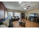 Open-concept living room featuring hardwood floors and a ceiling fan at 5342 W Maldonado Rd, Laveen, AZ 85339