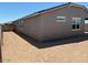 The backyard area offers low-maintenance desert landscaping and block wall fencing for privacy at 5526 S 246Th Ave, Buckeye, AZ 85326
