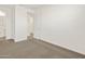 Bedroom featuring a carpeted floor and an open doorway to another room at 5526 S 246Th Ave, Buckeye, AZ 85326