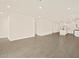 Open-concept living room showcasing recessed lighting and sleek, neutral tile flooring at 5526 S 246Th Ave, Buckeye, AZ 85326