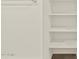 A closet with shelving maximizes vertical space and offers lots of storage in this home at 5526 S 246Th Ave, Buckeye, AZ 85326