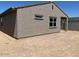 Exterior shot of the backyard, showcasing the home's architectural style at 5537 S 246Th Ave, Buckeye, AZ 85326