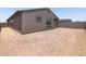 View of the side and back of the home with backyard, perfect for customization at 5537 S 246Th Ave, Buckeye, AZ 85326