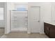 Bright bathroom with a tiled shower and glass door, paired with a modern vanity at 5537 S 246Th Ave, Buckeye, AZ 85326