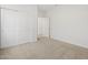 Bedroom featuring neutral carpet, white walls, and a double door closet at 5537 S 246Th Ave, Buckeye, AZ 85326