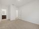 A light-filled room featuring neutral carpet, white walls, and entry to another room at 5537 S 246Th Ave, Buckeye, AZ 85326