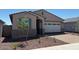 Charming single-story home featuring a two-car garage and professionally landscaped front yard at 5537 S 246Th Ave, Buckeye, AZ 85326