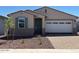 Charming single-story home featuring a two-car garage and professionally landscaped front yard at 5537 S 246Th Ave, Buckeye, AZ 85326