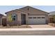 Beautiful single-story home with a 2-car garage and desert landscaping for easy maintenance at 5537 S 246Th Ave, Buckeye, AZ 85326