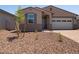 Well-maintained front yard with desert landscaping and a charming single-story home at 5537 S 246Th Ave, Buckeye, AZ 85326