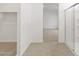Hallway view with a walk-in closet and a shower with glass doors at 5537 S 246Th Ave, Buckeye, AZ 85326